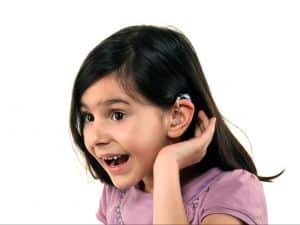Young girl with a hearing aid