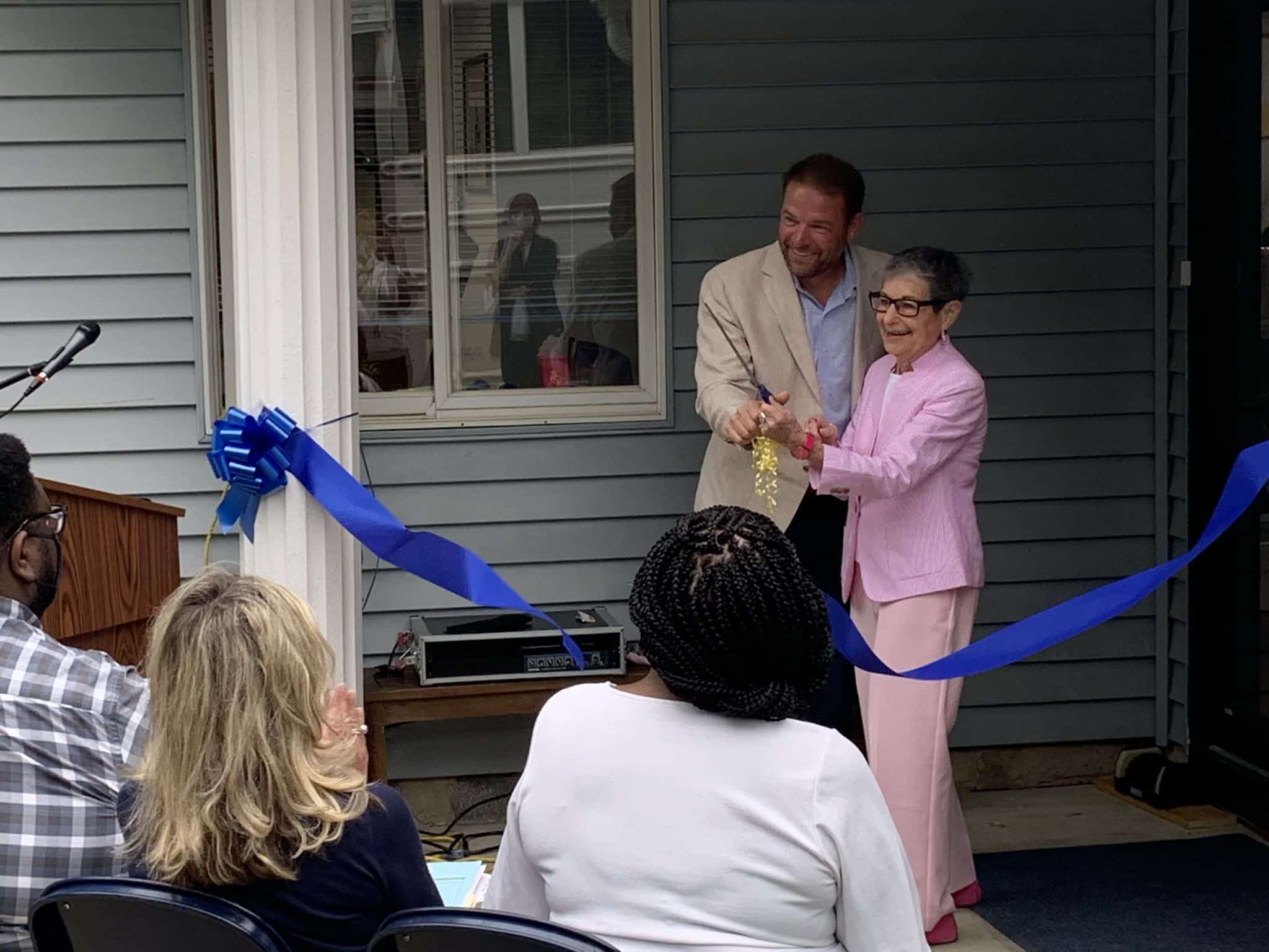 Dr. Jacobs cuts the ribbon